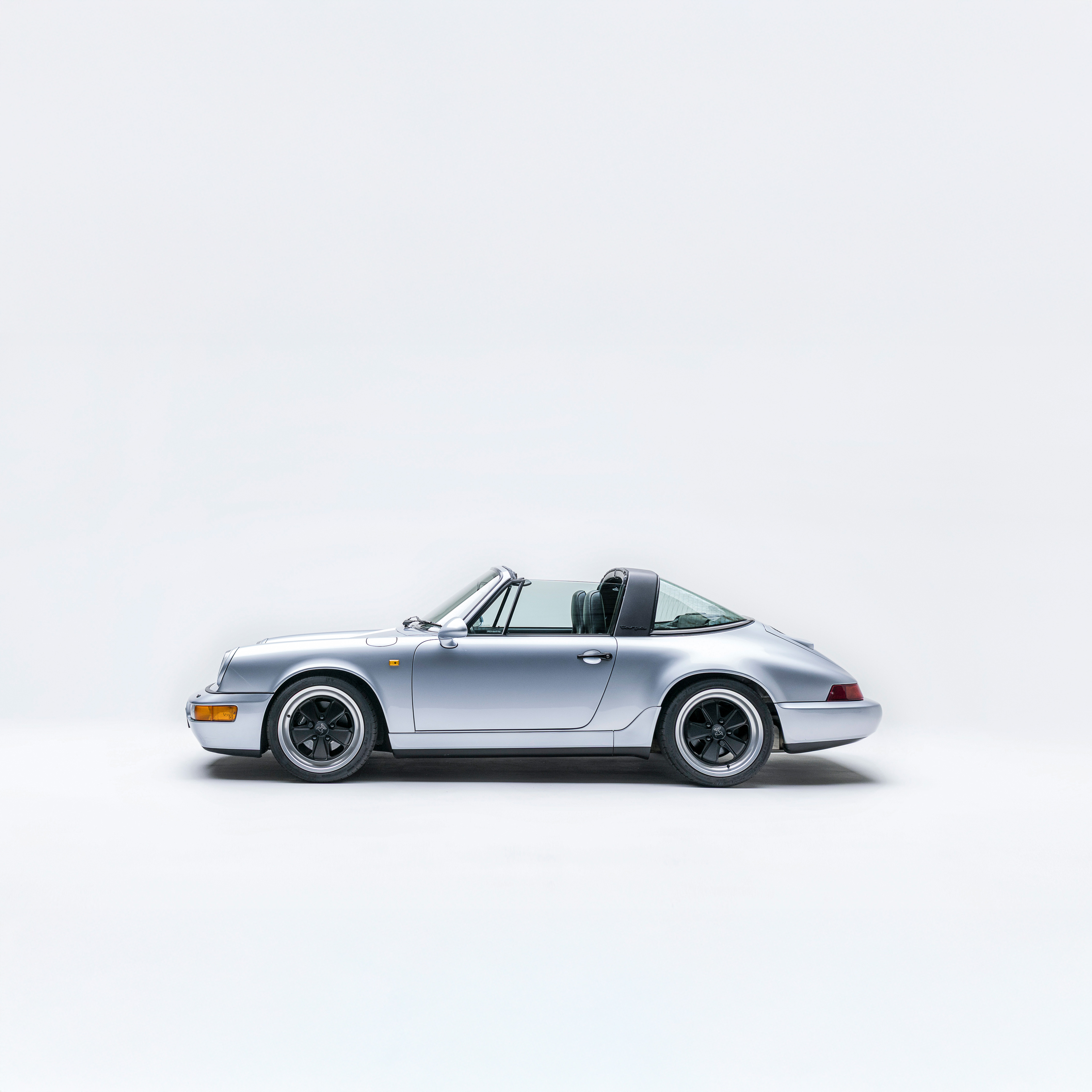 Porsche 964 Carrera 2 targa in Polar Silver — side profile